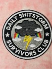 Daily Shitstorm Survivors Club Iron-On Patch – Funny Storm Cloud Rainbow Badge