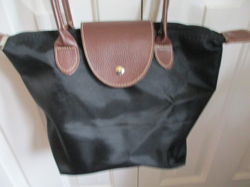 Black fabric, tan faux leather trim/handles, plastic lined, bucket/hand bag - Picture 2 of 6