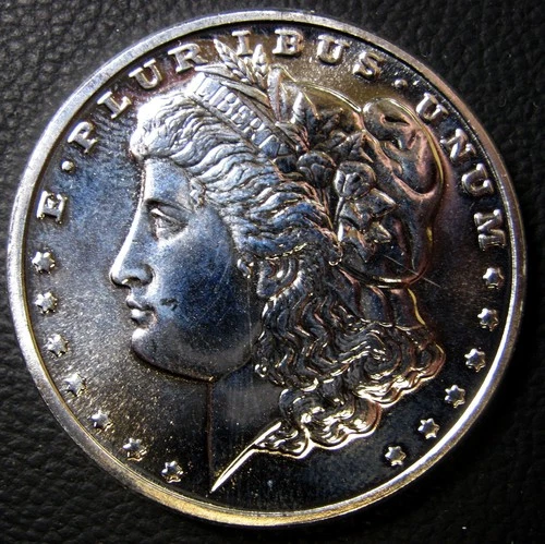 BELOW  SPOT!  1 TROY OZ.  SILVER MORGAN ROUND.  .999 FINE. FREE SHIPPING!
