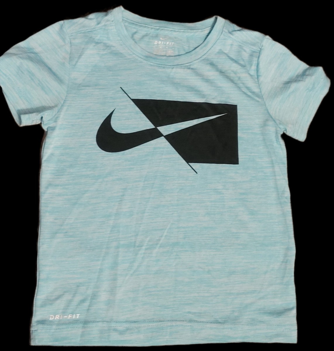 white and turquoise nike shirt