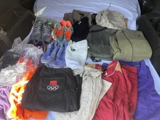 38 pieces men/women mixed lot clothes & tennis shoes, belt and more.