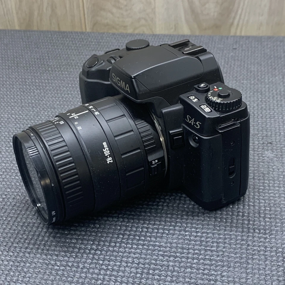 Paquete de cámara y lente Sigma SA-5 con zoom SIGMA 100-300 mm y convertidor Sigma AF Foto 4 de 4