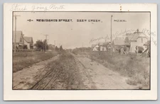 Postcard 1912 RPPC Dirt Road Residential Street in Deer Creek, MN.