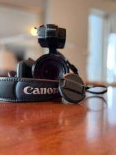 Canon XF200 in black with microphone and waterproof back packs