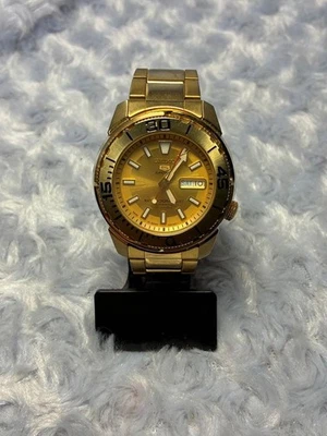 Montre SEIKO 5 Sports Gold Day-Date lunette tournante ne fonctionne pas - Photo 1/4