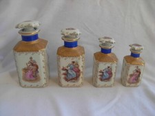 LIMOGES,VINTAGE FRENCH PORCELAIN PERFUME BOTTLE SET,4 PIECES,XX CENTURY.