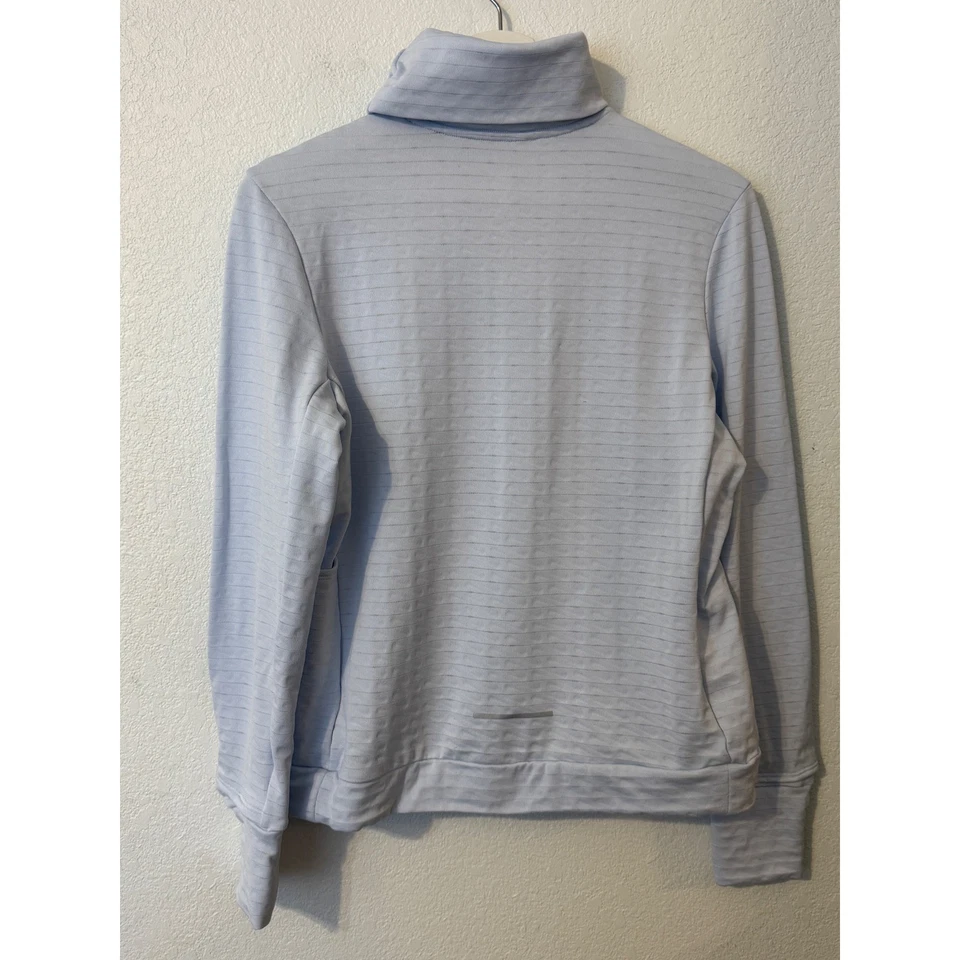 Camiseta para correr Nike Therma Fit azul claro cuello alto manga larga Foto 2 de 4