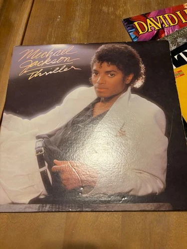 Box lot 15 old vinyl records from the 1980's. Michael Jackson, John Denver, etc
