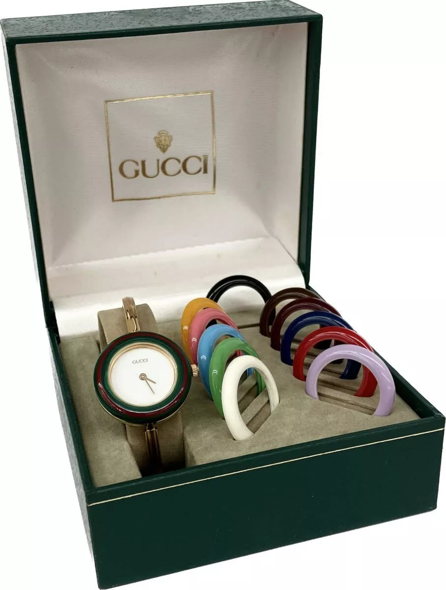 Lunette de changement Gucci 12 couleurs cadran blanc/or montre femme dans sa boîte étui fonctionne