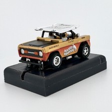 Auto World '72 Ford Baja Buckin' Bronco, Gold, XTraction Chassis, H.O. Slot Car