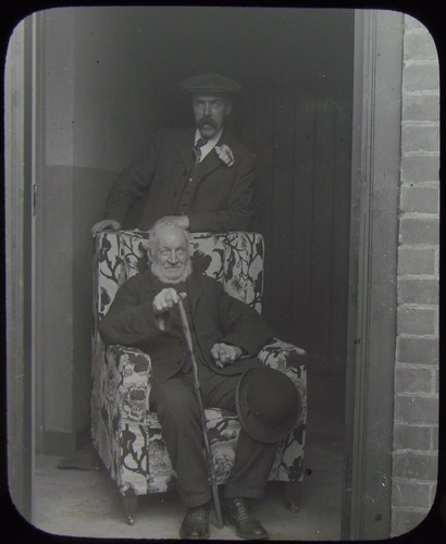 UNUSUAL Glass Magic Lantern Slide MAN SITTING IN CHAIR IN DOORWAY C1900 PHOTO