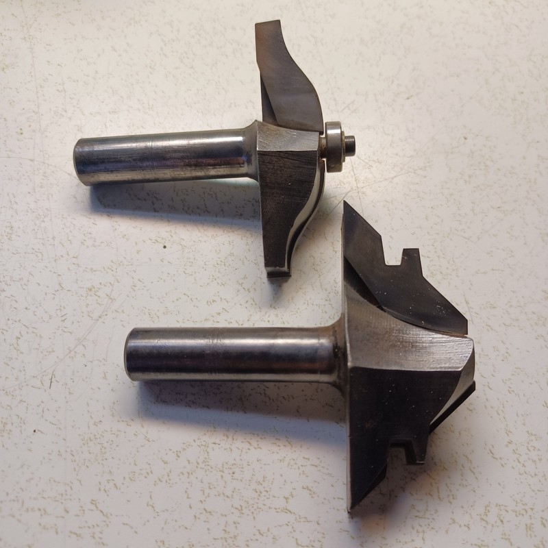 Two carbide inserted router/shaper bits