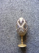 vintage egg on gold stand with glass swan inside. approx 6 inches tall. s.m art