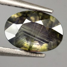 0.70Ct.Natural Sapphire Yellowish Green Oval Normal Heated Australia Iridescence