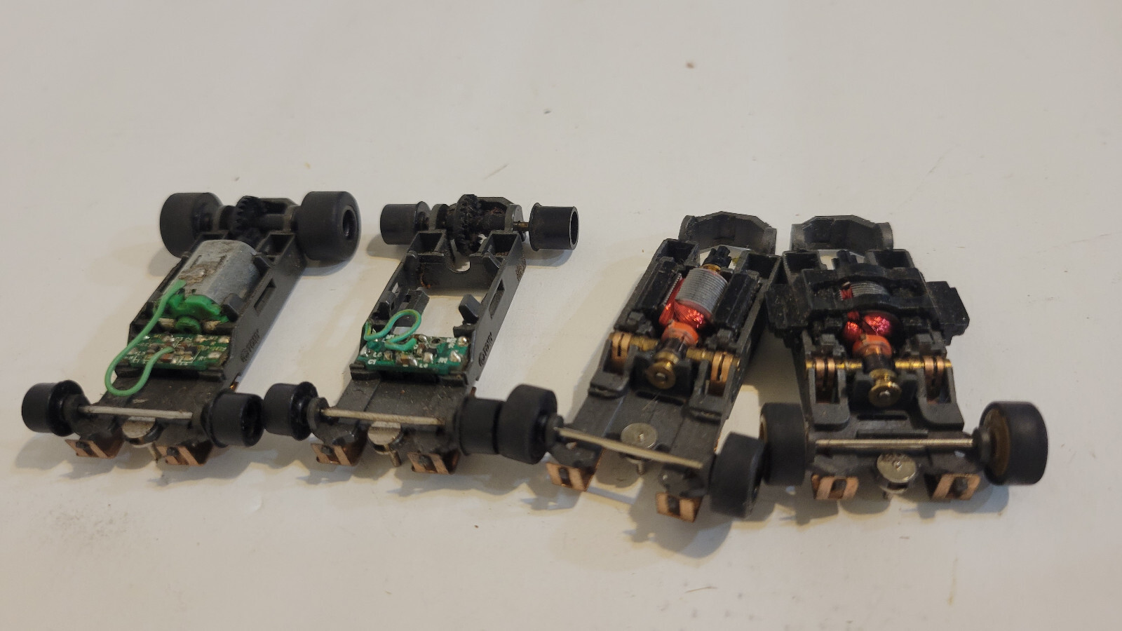 (4) AFX Tomy F1 Indy HO Slot Car parts Chassis. Mega G GPlus Motors