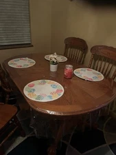 Solid Wood Dining Table With Leaf 4 To 6 Chairs Been Covered With Plastic.