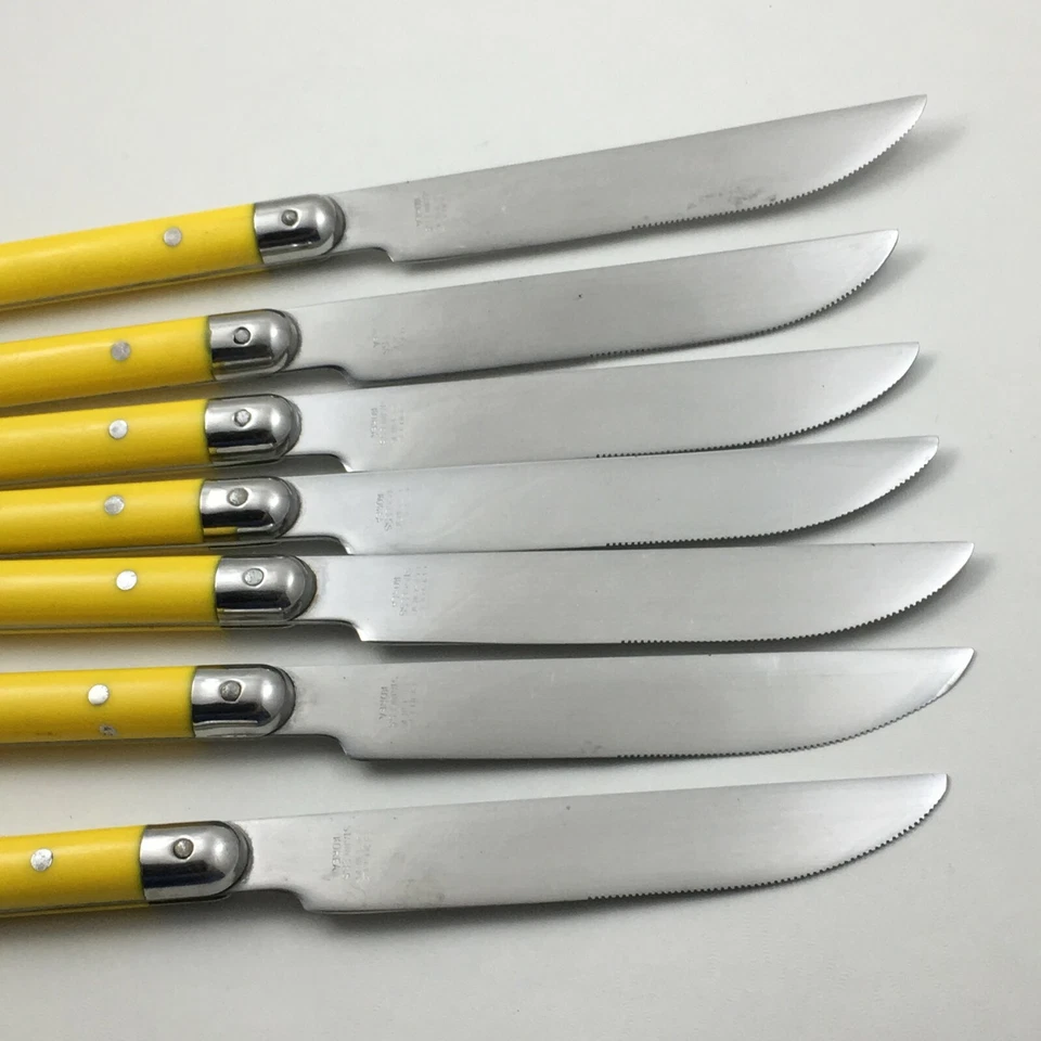 7 cuchillos Crown Corning de acero inoxidable de 8 3/4" Corea con mango de plástico amarillo cubiertos Foto 2 de 4