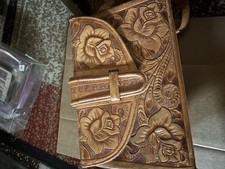 This vintage Mexican hand-tooled leather purse is generally