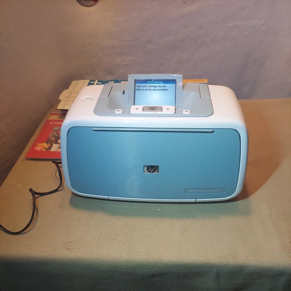 HP Photosmart A522 Compact Photo Printer and photo paper. Make offer