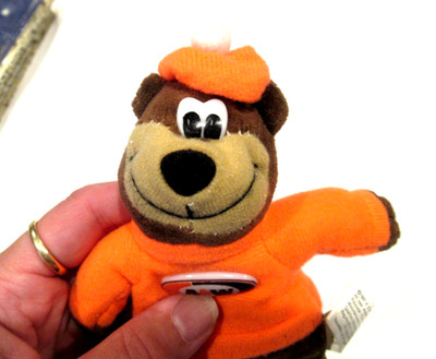 A & W Root Beer bear with orange sweater and hat