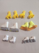 6 pairs of rollers skates, rollerbkades, and ice skates for Barbie and Ken