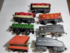 7 VINTAGE TIN & PLASTIC MARX TRAINS - CABOOSE,  BOX CARS, DUMPER & PASSENGER