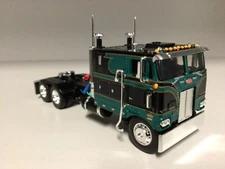 DCP 1/64 BLACK & GREEN 110" PETERBILT 352 LONG FRAME W/TEXAS BUMPER 1/2FENDERS