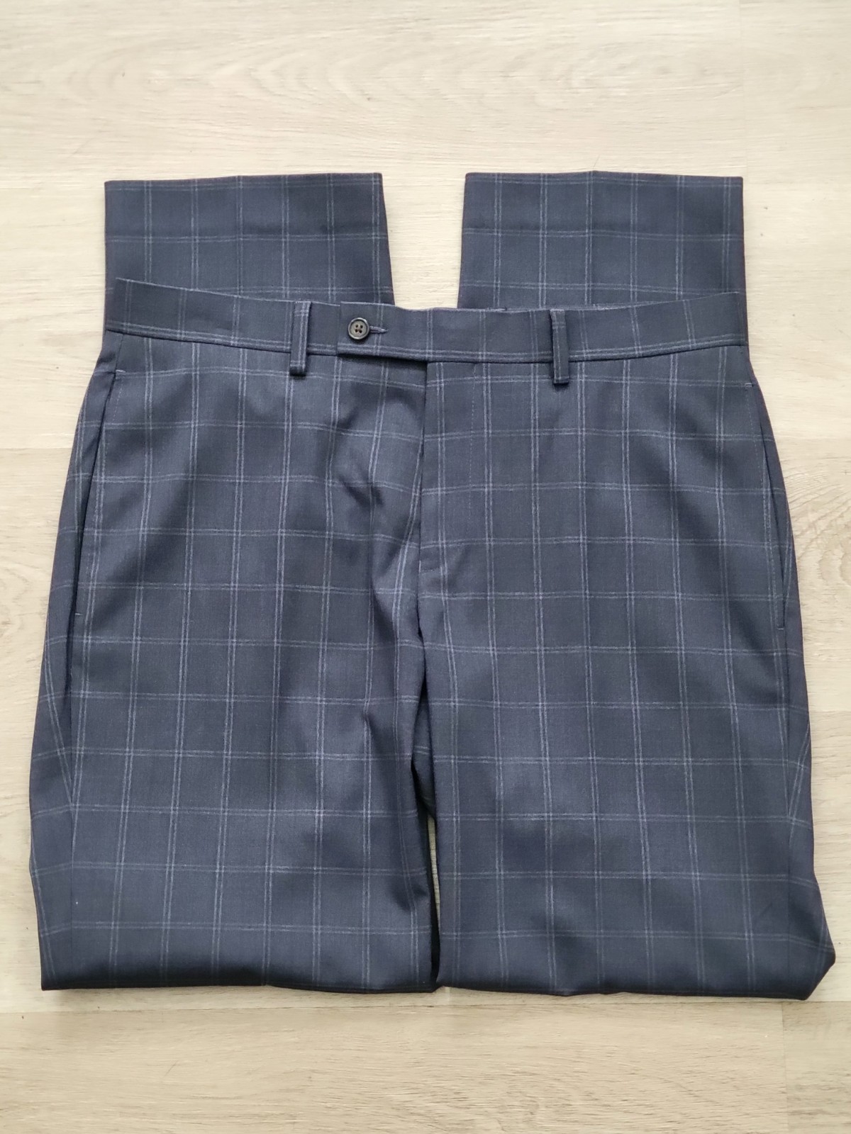 Blue Ralph Lauren men’s dress pants with gray plaid pattern, size 32W x 30L, laid flat on light wood floor.