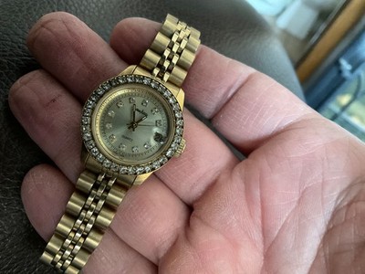 Neiman Marcus womens cz bezel date watch new batt gold tone fit to 7 in. Nice!