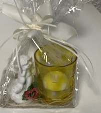 Aniołek zapakowany w celofan jako świecznik na podgrzewacze