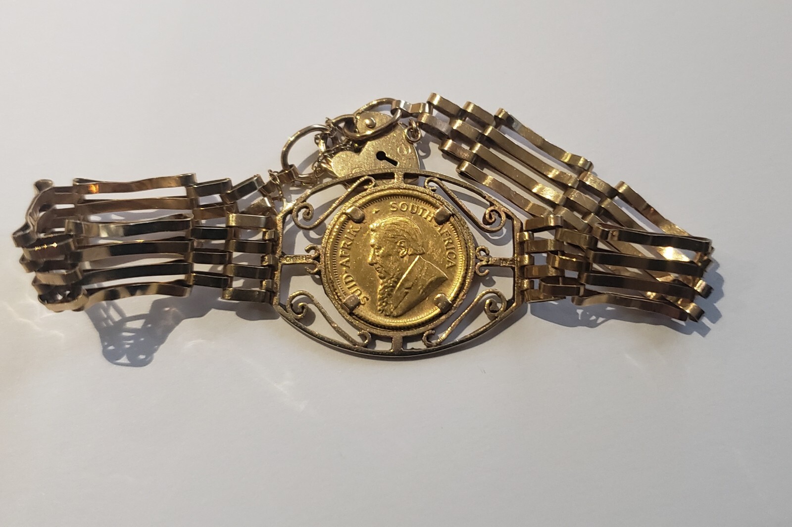 9ct Gold 4 Bar Gate Bracelet With 1/10th Krugerrand Gold Coin eBay