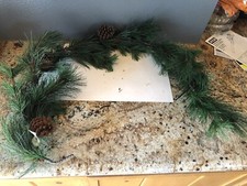 Christmas pine garland with pine cones. 9 ft
