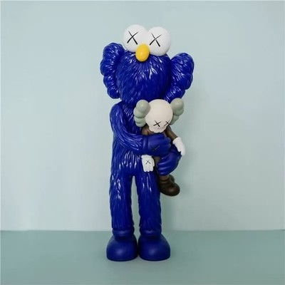 Blue kaws figure with baby