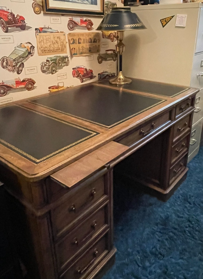 A genuine mid-century Modern campaign-style executive desk with leather top — the kind of statement furniture that anchors an entire room and makes every Zoom call look cinematic.