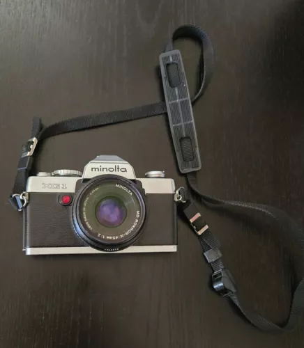 Minolta XG1 Camera w/ 49mm Lens, carrying strap and 2 rolls of film included