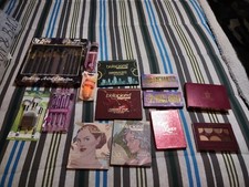 Lot Of Eye Shadow Palettes And Makeup Brushes