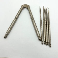 Vintage HMG Nut Cracker With 5 Picks Spring-loaded Metal Grip