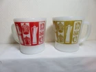 2 Vtg Fire King milk glass  Kitchen Aids pattern red and gold  coffee mugs