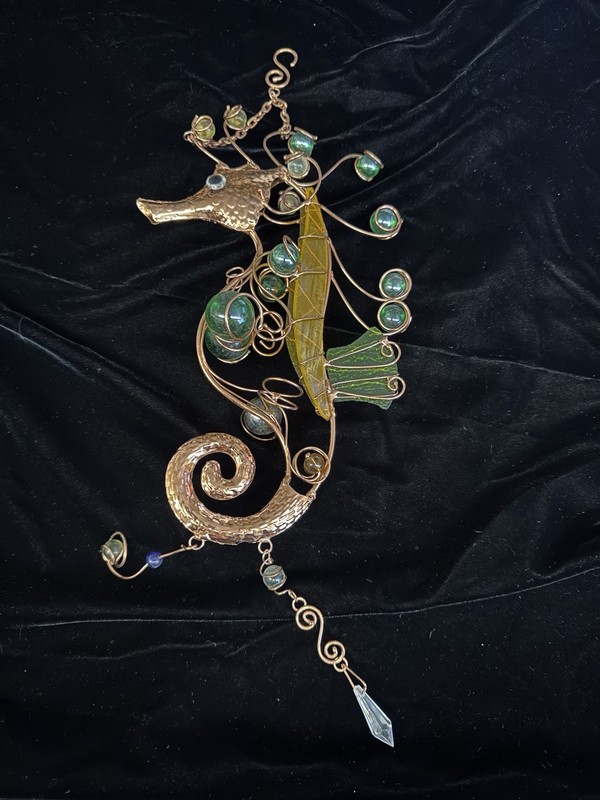 This is a handcrafted seahorse suncatcher