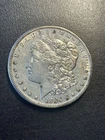 1884 S Morgan Dollar AU