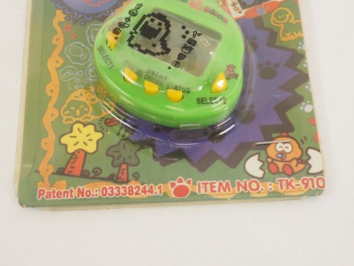 New Old Stock Dinkie Dino 24 in 1 weiß RakuRaku Dinokun TK-910 virtuelles Haustier - Bild 3 von 4