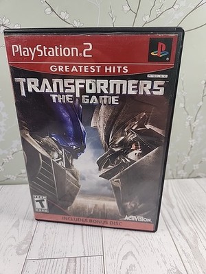 Transformers The Game Sony Playstation 2 PS2 Complete w/ Manual Bonus Disc