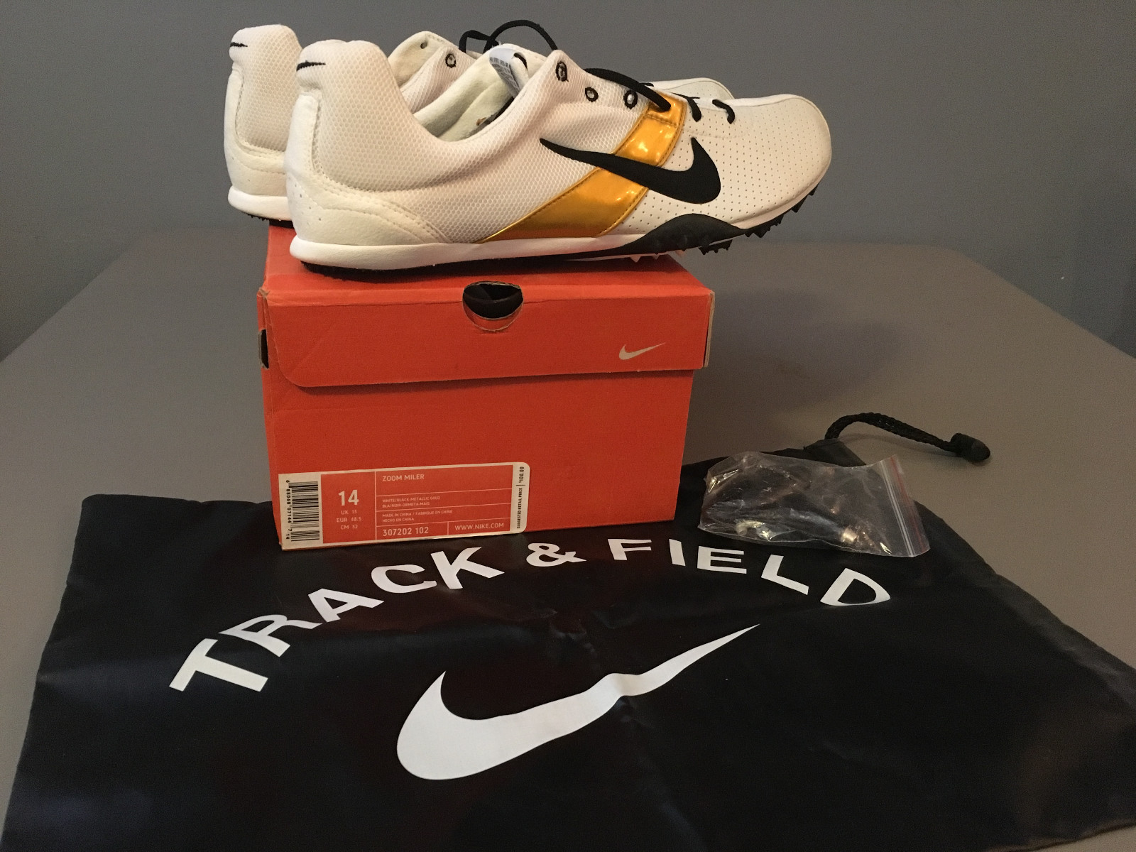 gold nike track spikes