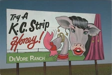 Devore Ranch Anthropomorphic Dressed Cow Kansas Turnpike Advertising postcard RC
