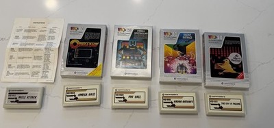 Vintage Commodore VIC-20 game lot including boxed and loose cartridges.