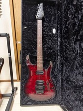 Suhr Modern Carve Top E-Gitarre Faded Chili Pepper Red Burst