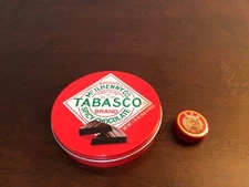 Pair of rare advertising tins Big Tabasco Chocolate and tiny Tiger Balm sample
