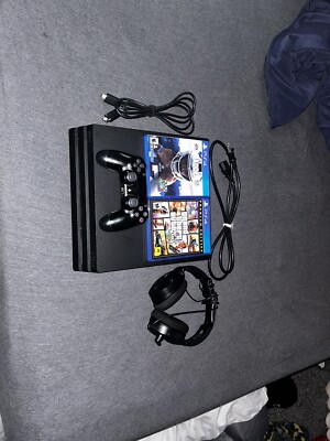 Playstation 4 pro 2tb comes with two games and a headset and cords