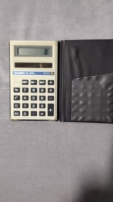 Vintage Casio SL-300G Solar powered pocket calculator with fold case