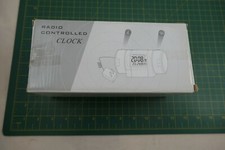 Radio Controlled Clock With Calendar, Digital Thermometer, And Time Zone